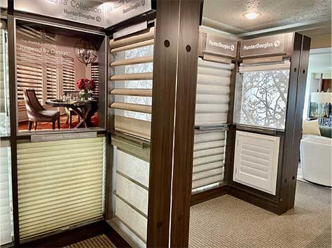 A display of multiple Hunter Douglas window coverings