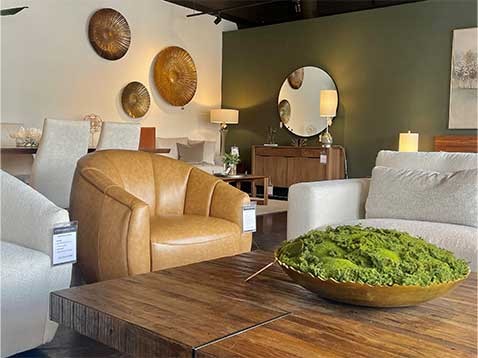 A rustic wooden table surrounded by comfortable chairs